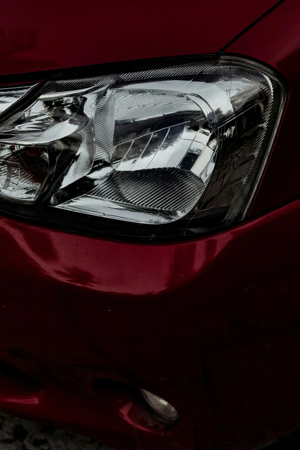 red car with broken mirror
